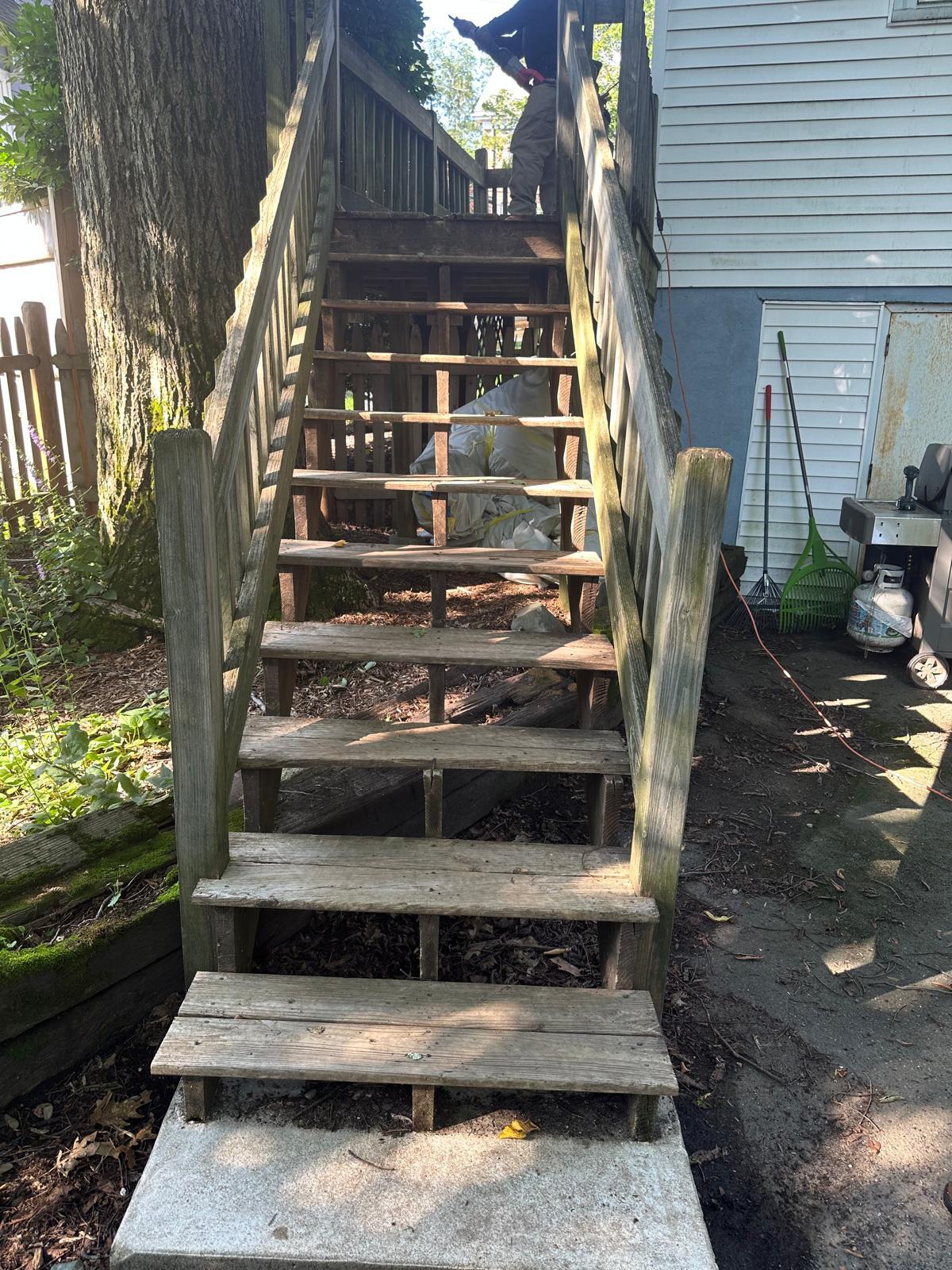 Before: weathered, decaying wooden deck stairs